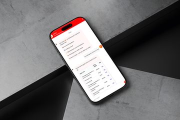 The Sasha chat open on a phone. Sasha greets the reader and offers help finding a book, recommendations or order status. The reader asks for a horror novel, and Sasha answers with a table of titles, prices in SGD and links.