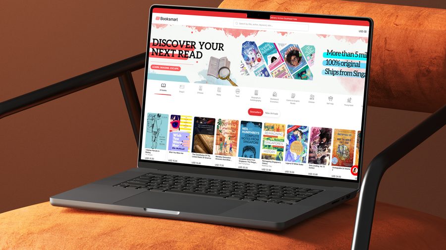 The Booksmart storefront open on a laptop, showing the Discover Your Next Read banner above rows of bestsellers.